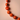 Close Up of Nova Necklace Orange – Bold Tagua Seed Beads with Black Bow Tie Handcrafted in Ecuador