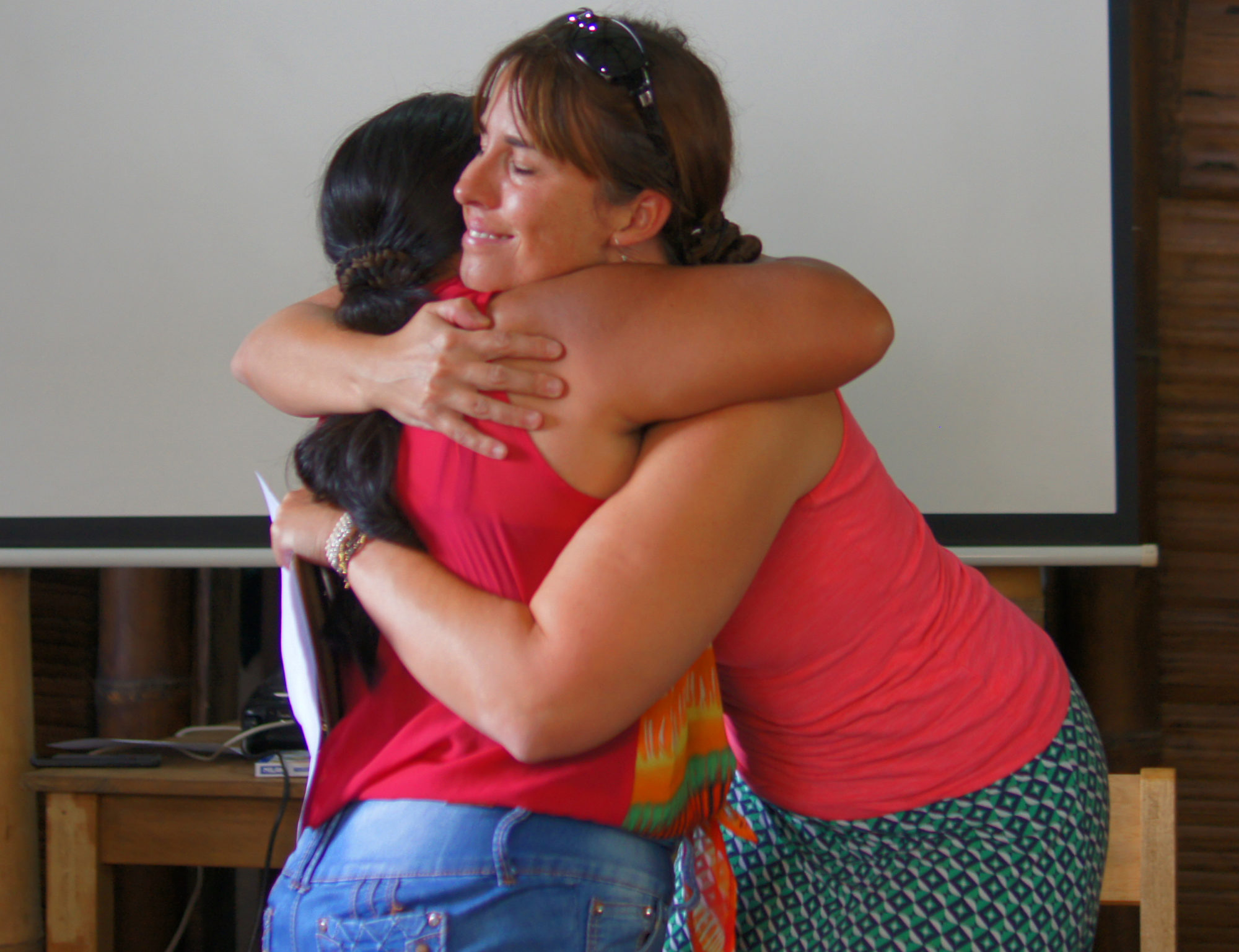 Founder Kara Wiegand hugging one of our Artisan Partners